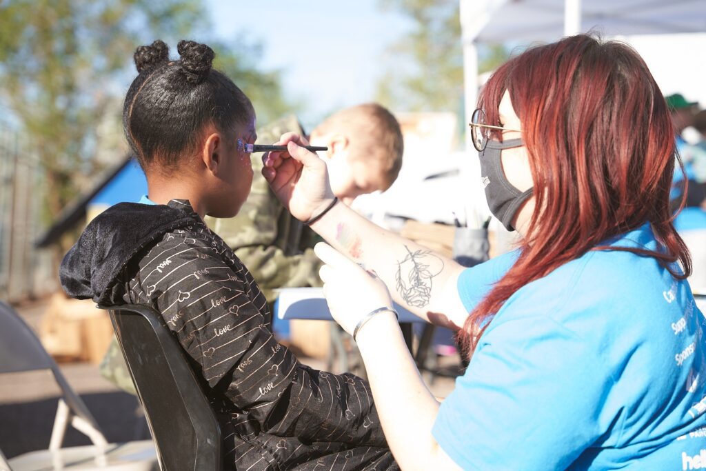 Face painting activity during Capstone Contributes event