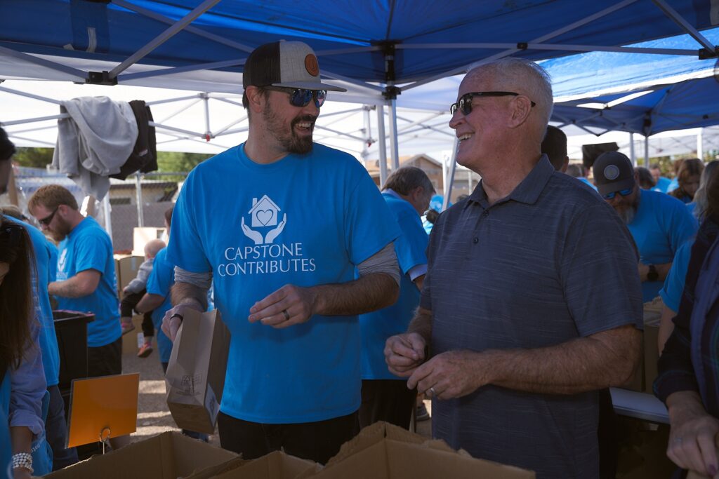 Capstone Contributes volunteers packing donations at community event