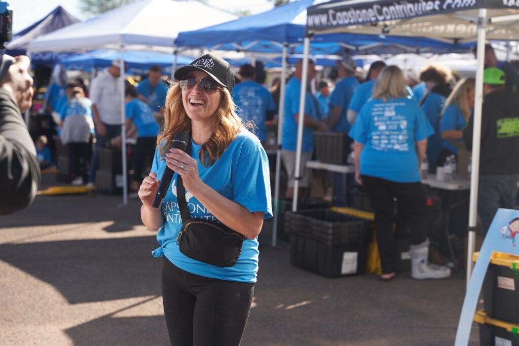 Capstone Contributes volunteer interviewed at community outreach event